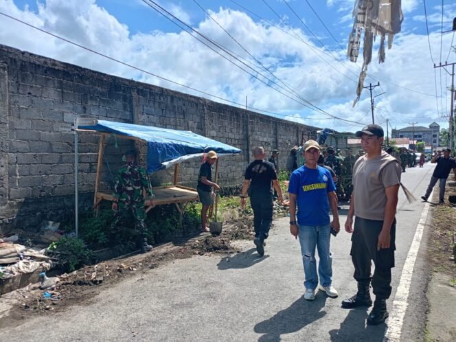 
					Wujud Kemanunggalan TNI-Rakyat, Kodim 1310/Bitung dan Yonif 916/BS Bersama Warga Bersihkan Kompleks Kanopi